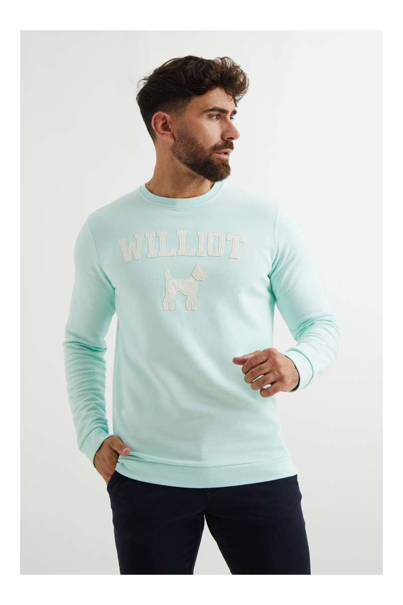 Sudadera turquesa de Williot con logo tipo parche en el pecho. Ideal para looks casuales con un punto distintivo 🐶✨