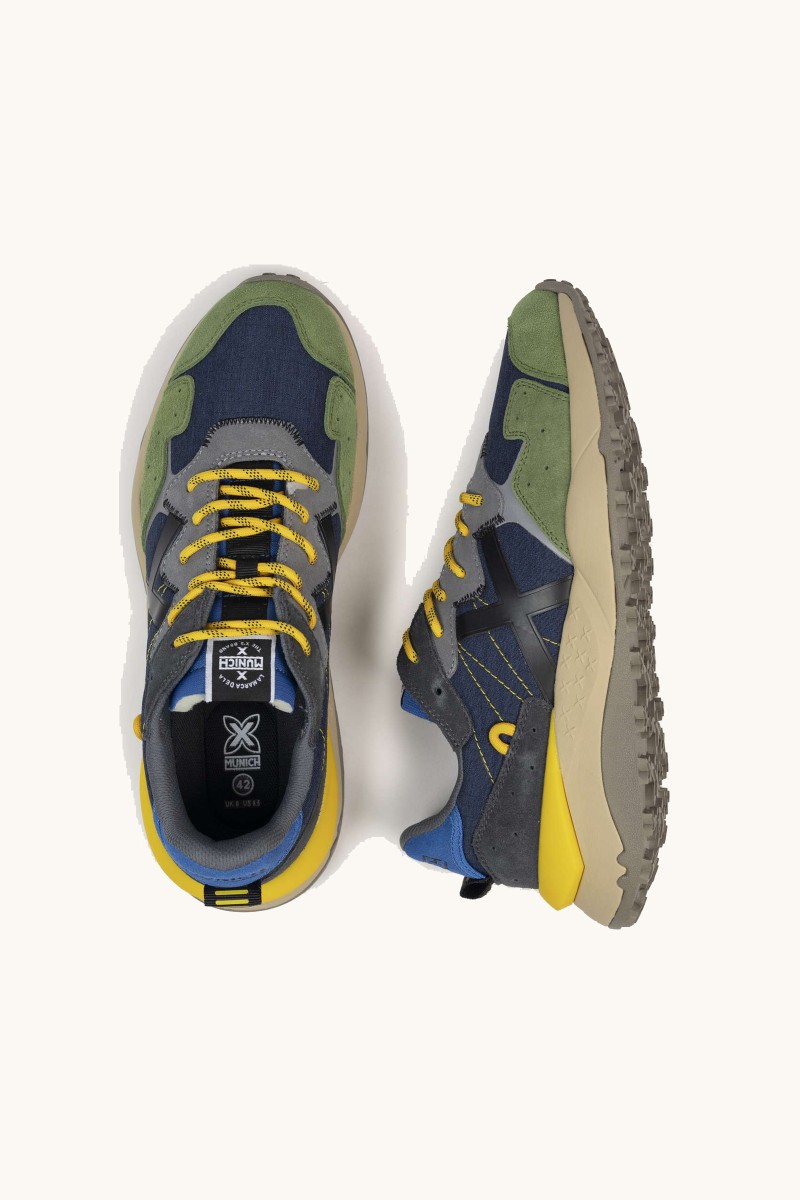  Zapatilla de Munich con suela chunky, diseño robusto y estilo deportivo. Ideal para acompañarte en el ritmo del día a día. 