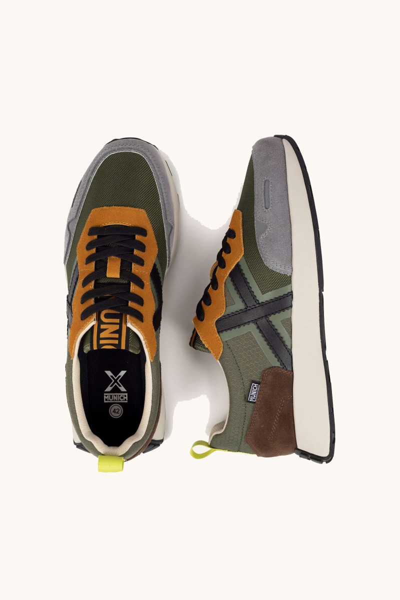  Zapatilla Munich que combina herencia deportiva con un diseño estilizado. Perfecta para looks urbanos con carácter. 