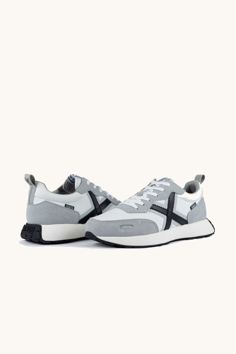  Zapatilla Munich con alma deportiva y estética elegante. Inspiración vintage y carácter urbano. 