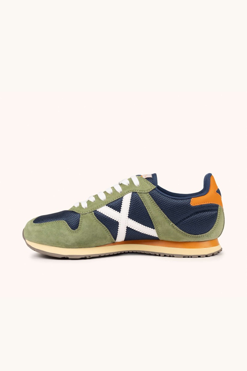  Zapatillas Munich en verde oliva y navy con estilo retro, perfectas para looks urbanos cómodos y con personalidad. 