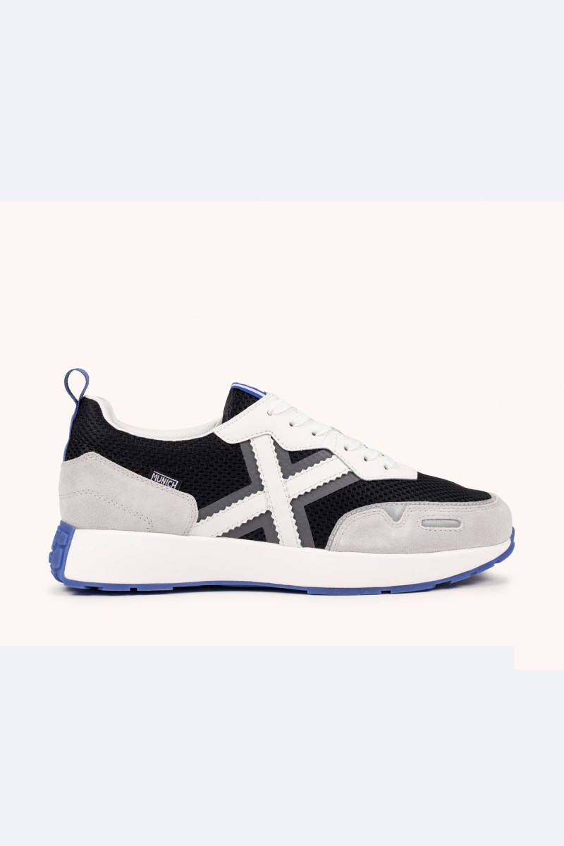  Zapatillas Munich en blanco, negro y gris con estilo deportivo elegante, ideales para looks urbanos cómodos y versátiles. 