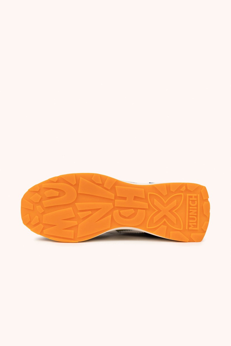  Zapatillas Munich en verde, marrón y azul con estilo deportivo elegante, ideales para looks urbanos cómodos y con personalidad. 