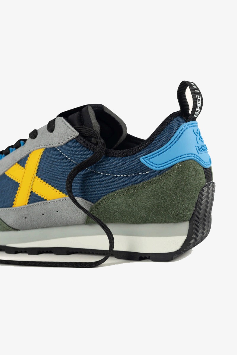  Zapatillas Munich de inspiración retro que recuperan la esencia de las siluetas clásicas de la marca. Una opción versátil para completar looks urbanos, casuales y business casual. 